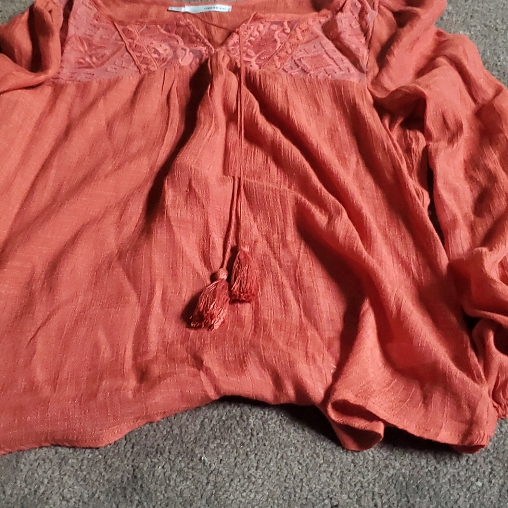 It is a nice orange shirt that you can dress up